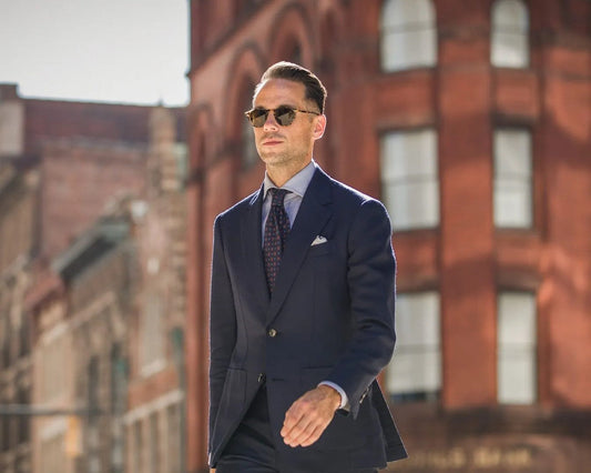 Groom in a Tuxedo, Groomsmen in Suits: How to Pull Off the Contrast Look
